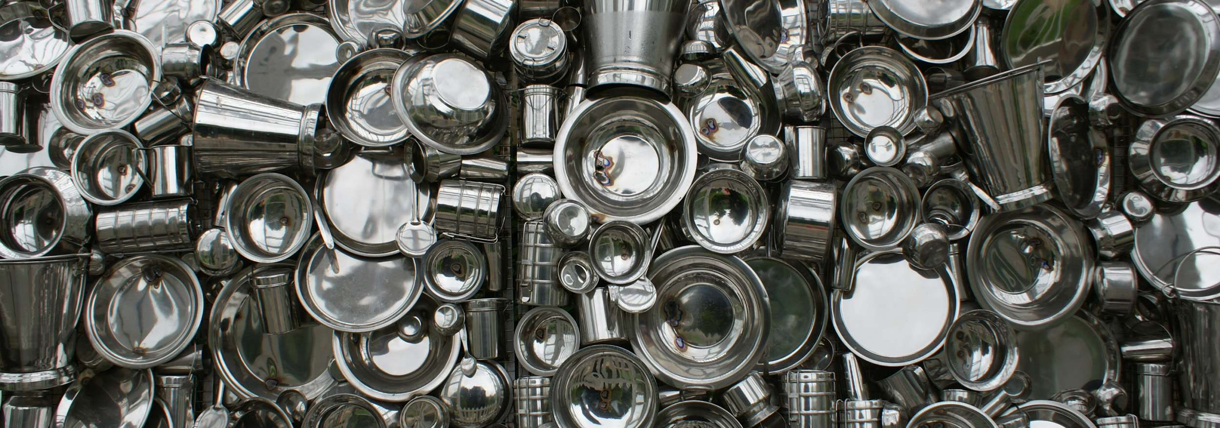 A photograph, taken from above, of several kinds of metal utensils